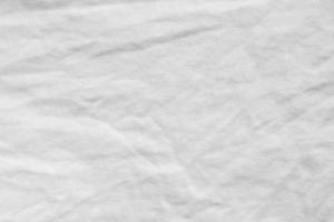 fond de texture de tissu de chemise en coton froissé blanc photo