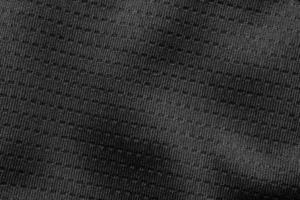tissu de tissu de sport noir texture de maillot de maillot de football gros plan photo