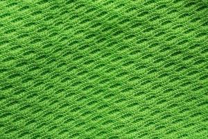 Tissu de vêtements de sport vert maillot de football texture jersey close up photo