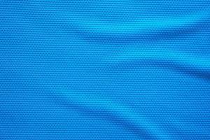 maillot de football bleu vêtements texture tissu vêtements de sport arrière-plan, vue de dessus en gros plan photo