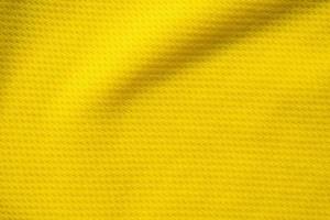 tissu de vêtements de sport jaune maillot de football texture jersey gros plan photo