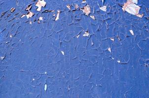 photo de la surface du mur de plâtre fissuré de la plainte bleue ancienne et pelée se bouchent comme arrière-plan et texture d'art.