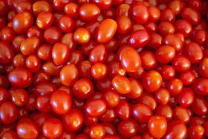 fond de tomates biologiques mûres rouges photo