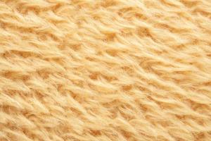 fond de texture de laine de tissu de fourrure pelucheuse jaune photo