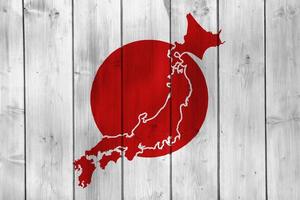 drapeau du japon et carte de contour du pays sur la texture. collage. photo