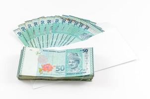 Monnaie malaisienne sur fond blanc photo