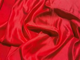texture de tissu rouge pour fond avec espace timide. conception de papier peint saint valentin ou jour de noël photo