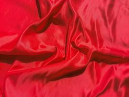 texture de tissu rouge pour fond avec espace timide. conception de papier peint saint valentin ou jour de noël photo