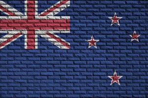 Le drapeau néo-zélandais est peint sur un vieux mur de briques photo