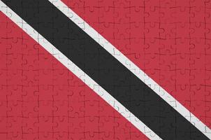 le drapeau de trinité-et-tobago est représenté sur un puzzle plié photo