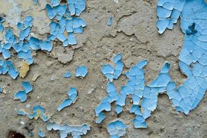 peinture ancienne, bleue, exfoliée et écaillée sur le mur de béton. l'arrière-plan. texture. photo