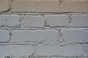 texture du mur de grenier en brique de construction en pierre blanche avec coutures. l'arrière-plan photo