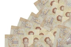 1000 billets de baht thaïlandais se trouvent dans un ordre différent isolé sur blanc. concept bancaire local ou de création d'argent photo
