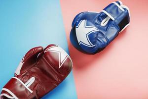 une paire de gants de boxe bleus et roses sur fond bleu et rose. photo