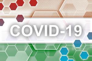 drapeau nigérien et composition abstraite numérique futuriste avec inscription covid-19. concept d'épidémie de coronavirus photo