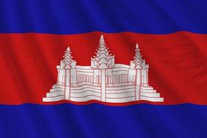drapeau du cambodge avec de grands plis agitant de près sous la lumière du studio à l'intérieur. les symboles et couleurs officiels de la bannière photo