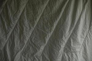 la couverture blanche sèche. couverture humide. texture de linge de lit. photo