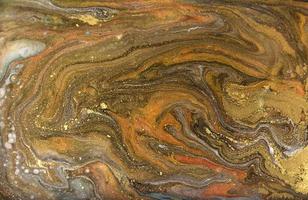 motif marbré bronze et or. texture liquide en marbre doré. photo
