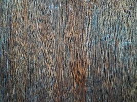 texture bois pour la conception et la décoration. il est de couleur marron foncé avec des lignes épaisses sur fond de bois naturel photo