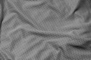 fond de texture de tissu de vêtements de sport, vue de dessus de la surface textile en tissu gris photo