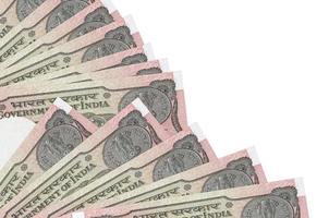 1 billets de roupie indienne se trouvent isolés sur fond blanc avec espace de copie empilés dans un ventilateur de près photo