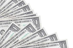 1 billets d'un dollar américain se trouvent isolés sur fond blanc avec espace de copie empilés dans un ventilateur de près photo