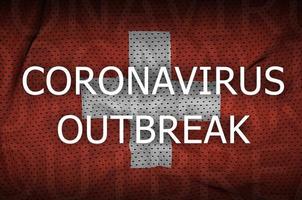 drapeau suisse et inscription de l'épidémie de coronavirus. virus covid-19 ou 2019-ncov photo