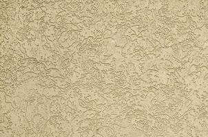 la texture du plâtre décoratif beige dans le style des scolytes photo