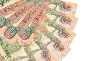 1000 billets de dollars guyanais se trouvent isolés sur fond blanc avec espace de copie empilés en forme d'éventail de près photo
