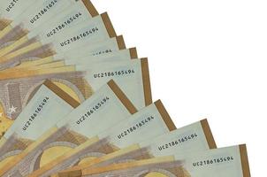 50 billets en euros se trouvent isolés sur fond blanc avec espace de copie empilés dans un ventilateur en gros plan photo