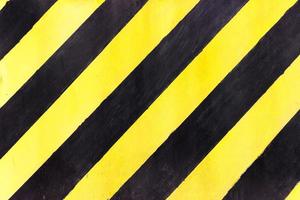 bandes de sécurité sur le chantier, signe noir et jaune en construction sur une texture grunge, vue de dessus photo