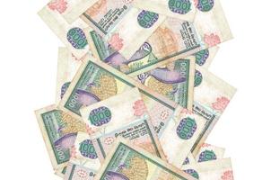 Billets de 1000 roupies sri lankaises volant isolés sur blanc. de nombreux billets tombant avec un fond blanc à gauche et à droite photo