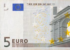 Fragment d'un billet de 5 euros en gros plan avec de petits détails marron photo