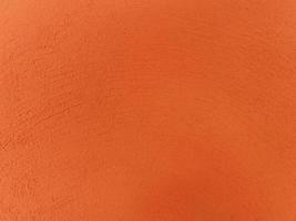 fond de texture de mur de ciment orange pour carrelage en pierre peint dans un intérieur moderne de papier peint de couleur claire orange, avoir de l'espace pour le texte. photo