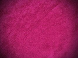 texture de tissu de velours rose utilisée comme arrière-plan. fond de tissu rose vide de matière textile douce et lisse. il y a de l'espace pour le texte. photo