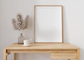 cadre photo vertical vide debout sur une table en bois dans un salon moderne. maquette d'intérieur dans un style minimaliste et contemporain. gratuit, copiez l'espace pour votre photo. vase, herbe de la pampa. rendu 3d.