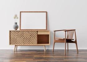 cadre photo vide sur un mur blanc dans un salon moderne. maquette d'intérieur dans un style scandinave. espace libre, copiez l'espace pour votre photo. console et fauteuil en bois. rendu 3d.