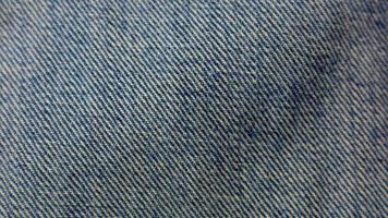 texture de jeans bleus comme arrière-plan photo