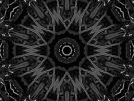 fond de kaléidoscope métallique argenté noir. motif abstrait et symétrique avec des vibrations sombres. photo