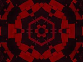 fond de kaléidoscope métallique rouge foncé. motif abstrait et symétrique avec des vibrations d'horreur photo