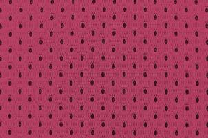 fond de texture de tissu de vêtements de sport. vue de dessus de la surface textile en tissu. image tonique en viva magenta, couleur de l'année 2023 photo