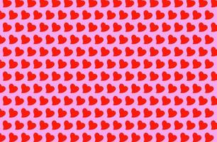 motif coeur rouge isolé sur fond rose. symbole de l'amant, de la saint valentin et du fond d'écran de l'amour de l'art photo