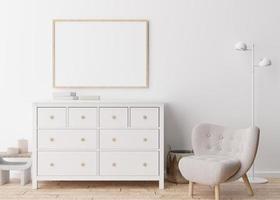 cadre photo horizontal vide sur un mur blanc dans un salon moderne. maquette d'intérieur dans un style scandinave. gratuit, copiez l'espace pour votre photo, affiche. fauteuil, buffet, lampe, livres. rendu 3d.