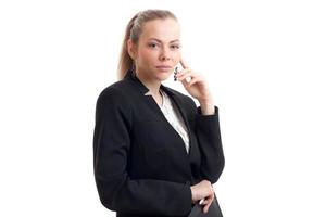 jeune belle blonde en uniforme d'affaires classique en regardant la caméra photo