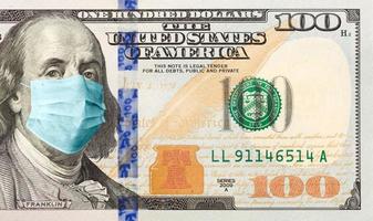 billet de cent dollars avec masque médical sur benjamin franklin photo