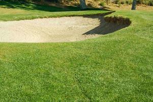 résumé du parcours de golf et du bunker de sable. photo