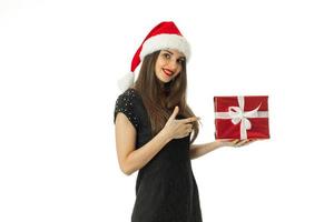 fille glamour en bonnet de noel souriant photo