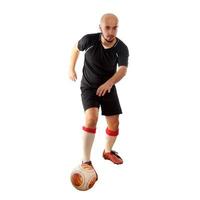 footballeur dribble sur fond blanc photo