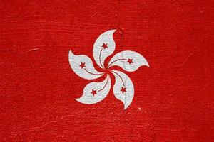 drapeau de hong kong sur un fond texturé. collage conceptuel. photo