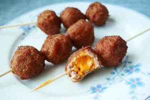 Close up of chicken cheese meat ball on plate photo